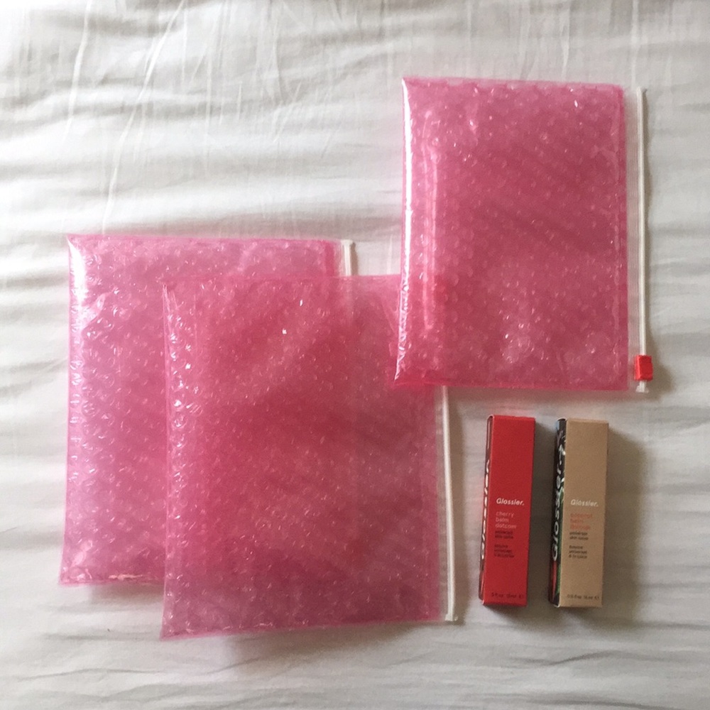 2 Glossier balm dot coms & 3 Glossier pouches